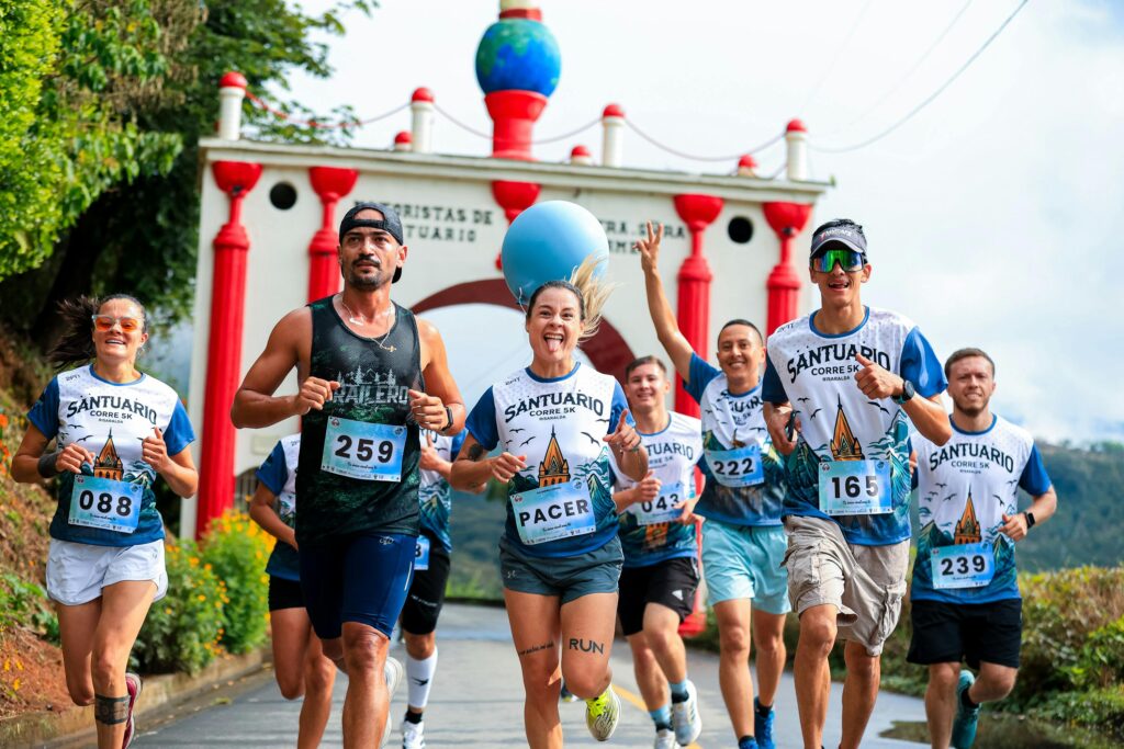 pexels-photo-34180189-34180189 Energetic group of runners participate in a vibrant 5K race at Santuário under a bright sky.